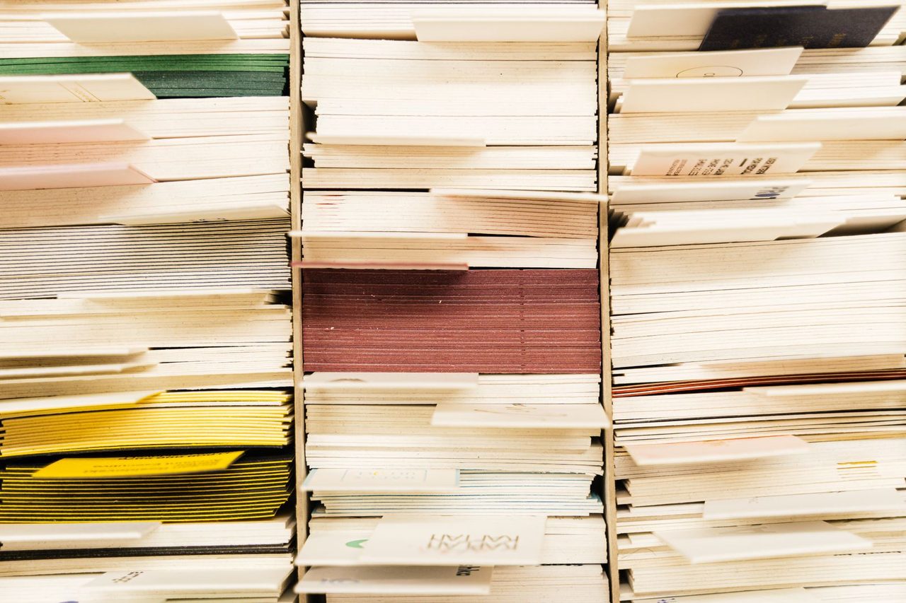 Color-coded documents and files, organized in trays