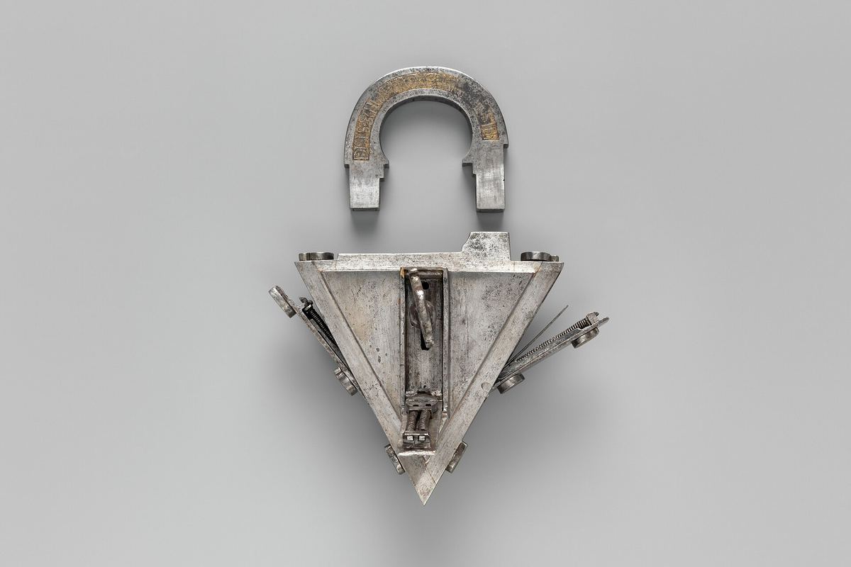 A padlock with its interior open, a symbol for how the mechanism works